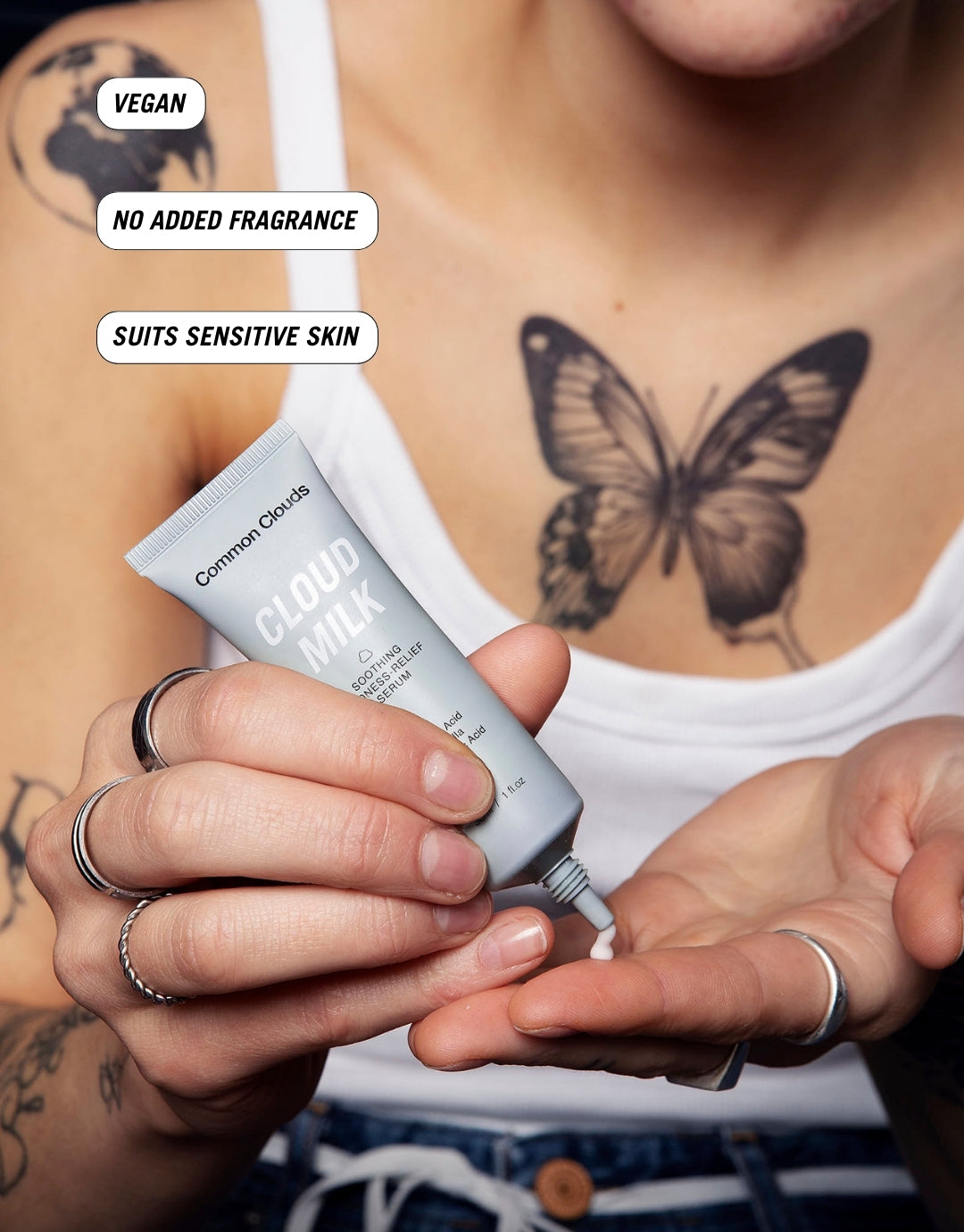 A girl is showing the texture of a soothing redness releif serum from Common Clouds.