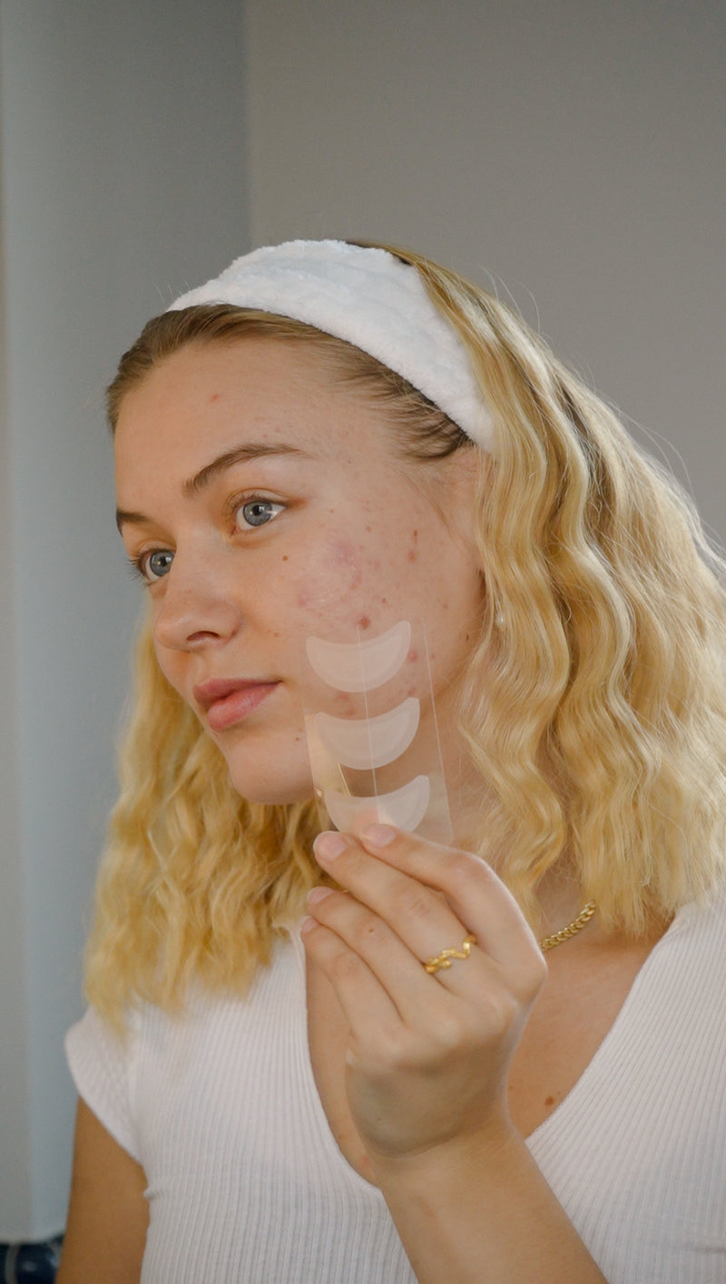 Girl holding moon patch pimpe patches vegan hydrocolloid patches for acne