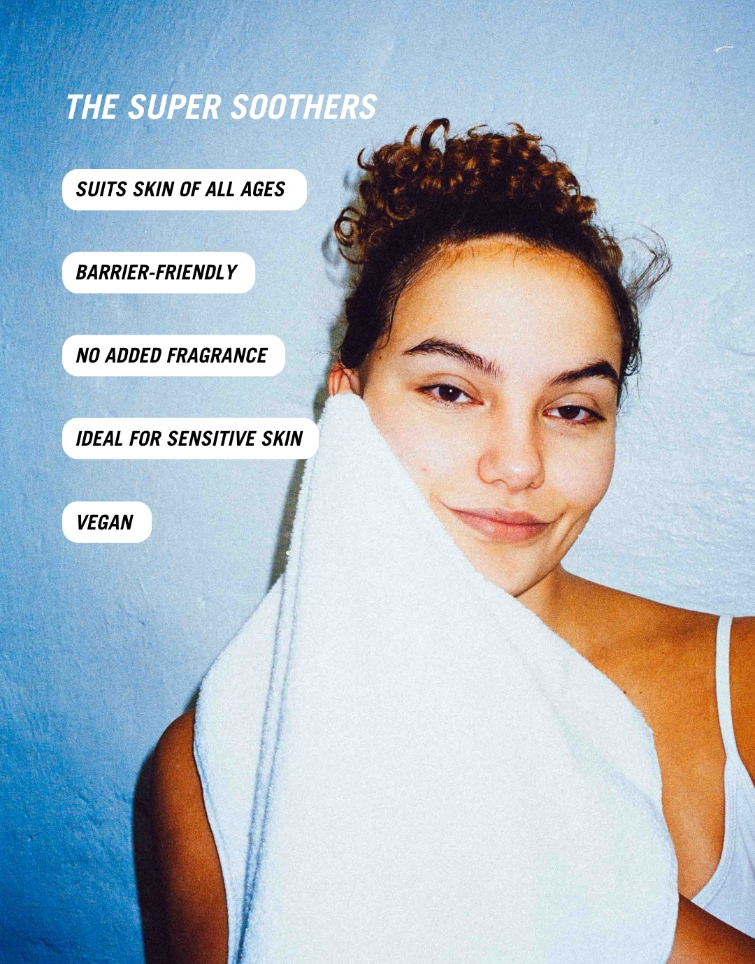 Girl drying of her face with a towel.