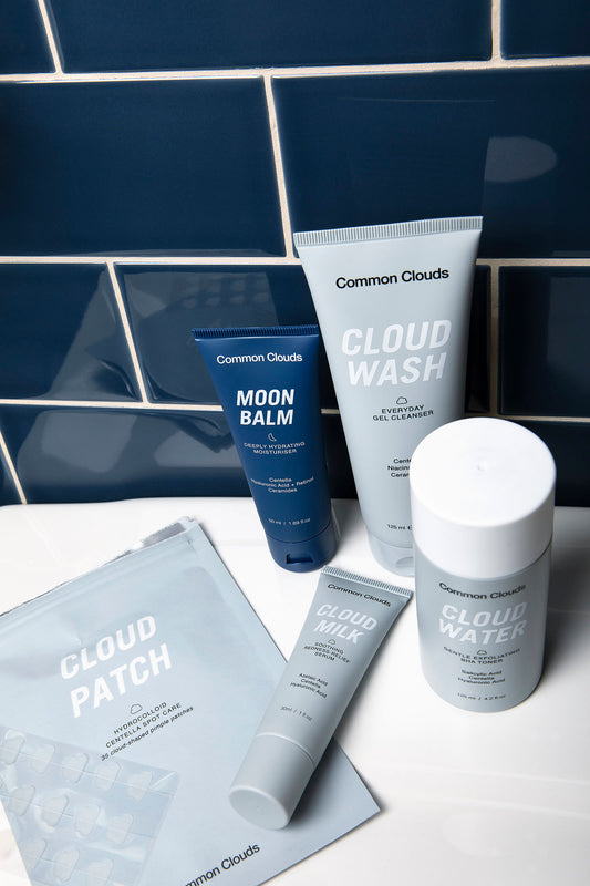 Common Clouds skincare products Cloud Patch, Cloud Wash, Cloud Water and Moon Balm on the bathroom shelf