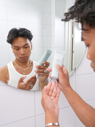 A guy just about to use Cloud Wash, a gentle cleanser for sensitive skin.